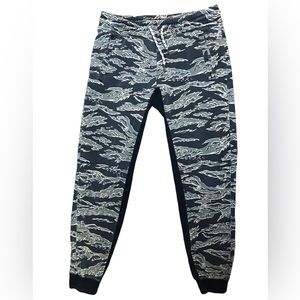 Green and black Y2K style camouflage joggers elastic waist stretch black trim